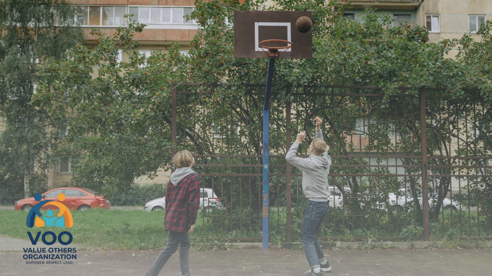 Youth playing basketball at a VOO Sports & Mentorship session