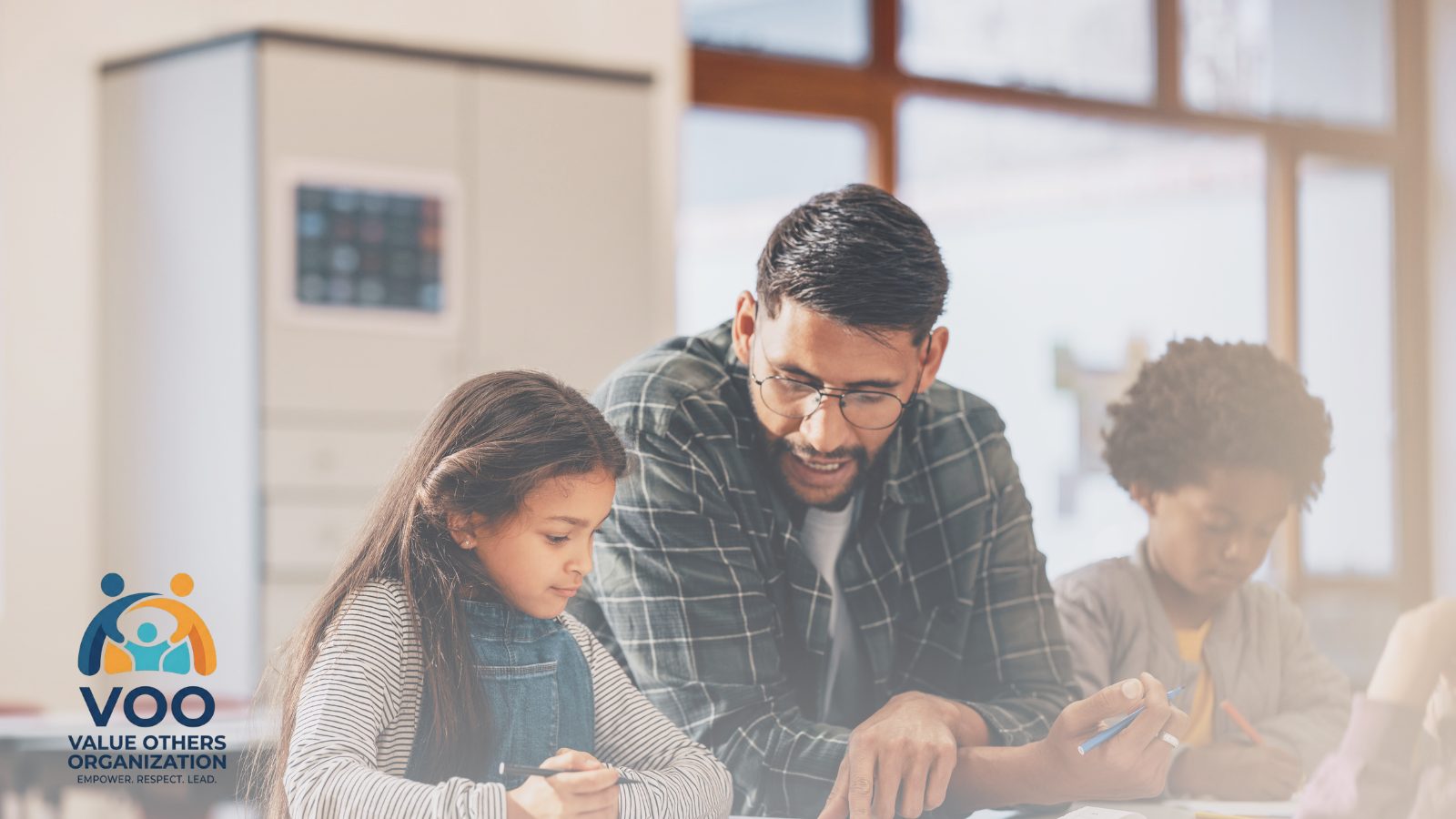 A mentor helping a student during a VOO program