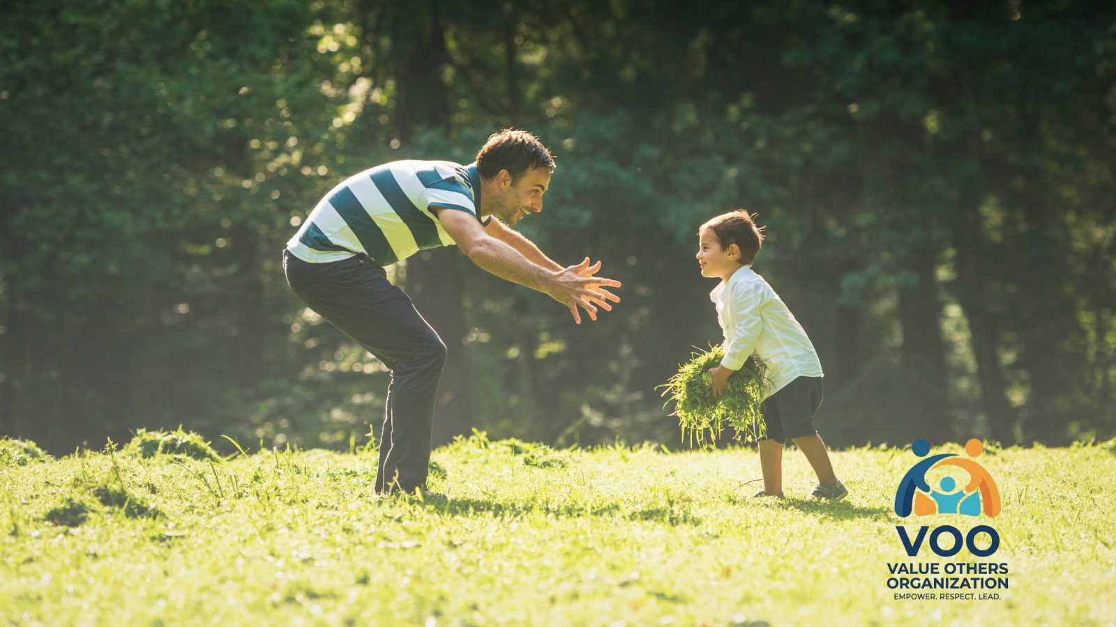 A father and son connecting outdoors through a VOO community program
